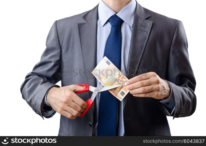 Man cutting money on white