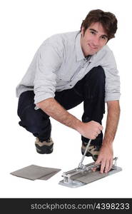 Man cutting tile