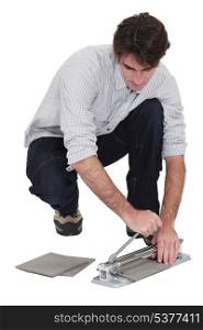 Man cutting tiles