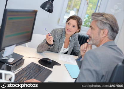 man dealing with a financial adviser at the bank