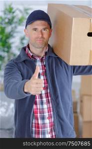 man delivering boxes during house move