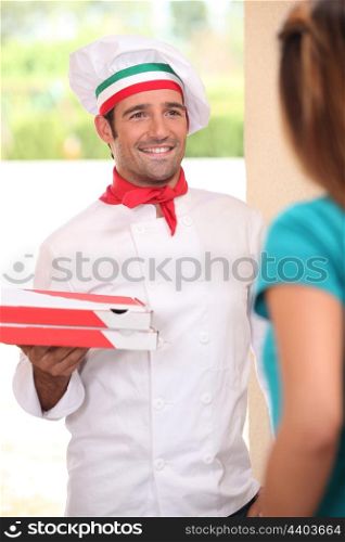 Man delivering freshly baked pizzas