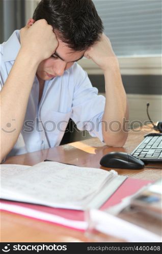 Man depressed at his desk