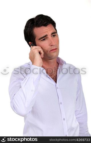 Man desolate on the phone