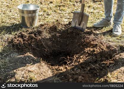 man digging hole with shovel plant tree. Beautiful photo. man digging hole with shovel plant tree