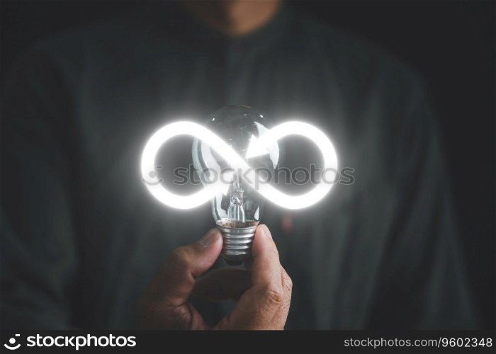 Man displays light bulb with infinite symbol icon, representing creative new idea. Innovation, unlimited brainstorming, inspiration, and solution. Development and data exchange for business growth.