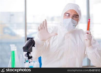 Man doctor checking blood samples in lab