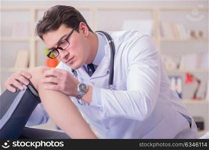 Man doctor taking care of sports injury
