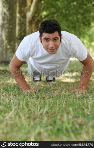 Man doing push-ups in the park