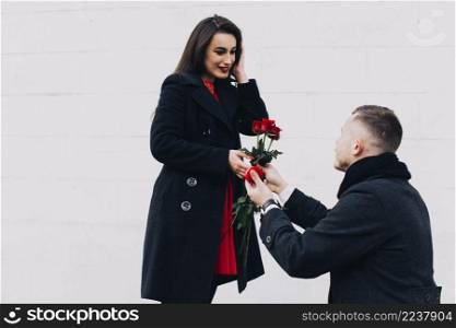 man doing romantic proposal street