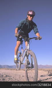 Man Doing Trick on Mountain Bike