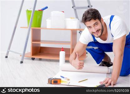 Man doing wallpaper refurbishment at home