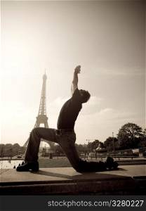 Man doing yoga in Paris France