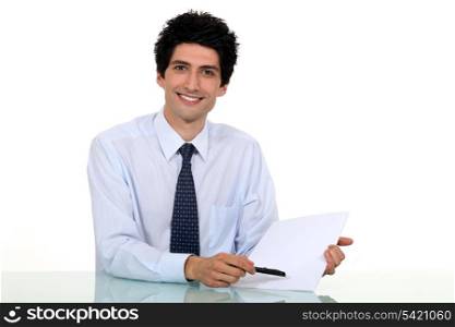 Man drawing attention to paper