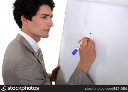 Man drawing on flip chart
