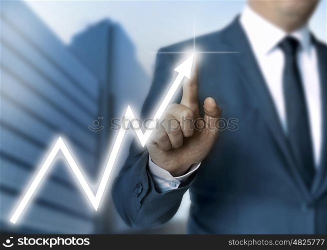 Man draws stock price touchscreen concept. Man draws stock price touchscreen concept.