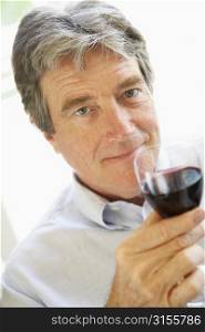 Man Drinking A Glass Of Red Wine