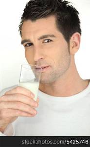 man drinking a milk glass