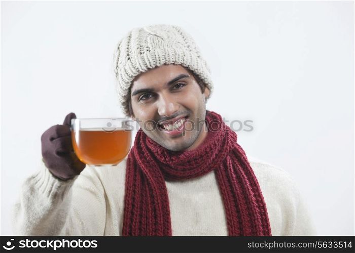 Man drinking black tea over white background