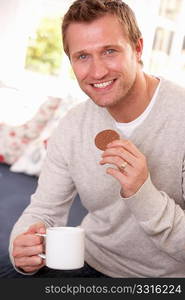 Man drinking from cup