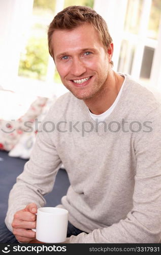 Man drinking from cup