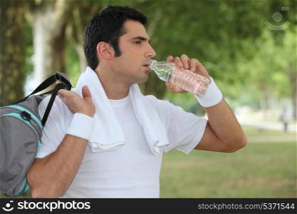 Man drinking water after a workout