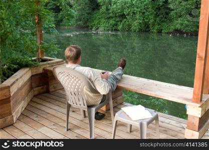 Man Drinking Wine by River