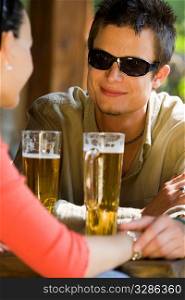 Man drinking with woman in bar