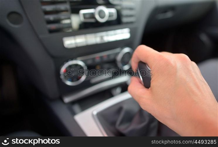 man driver hand shifting the gear stick