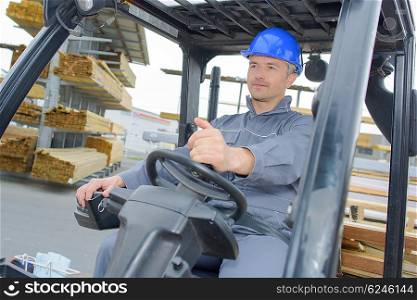 man driving a forklift