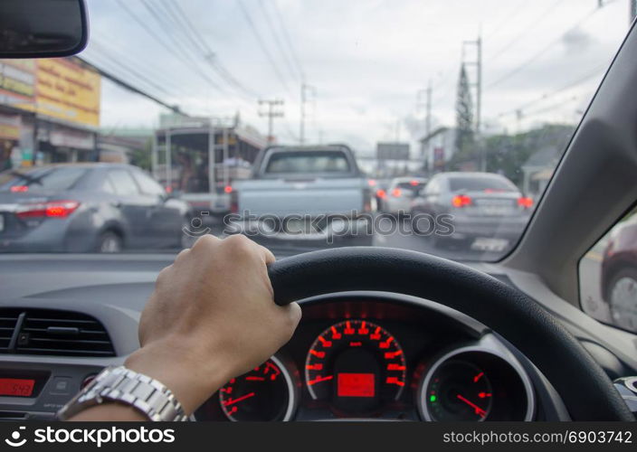 man driving car, hand hold steering wheel