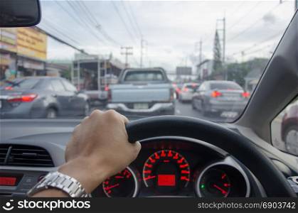 man driving car, hand hold steering wheel