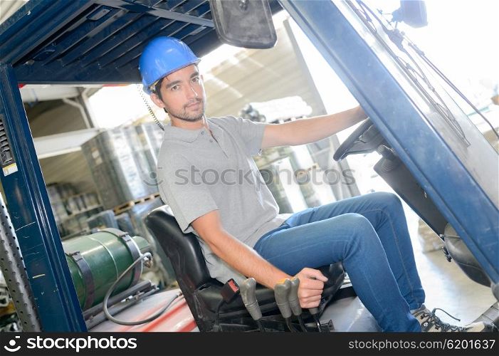 Man driving fork lift