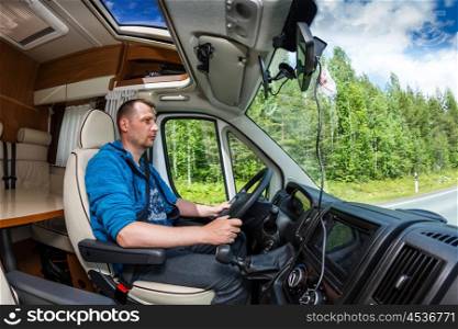 Man driving on a road in the Camper Van. Caravan car Vacation. Family vacation travel, holiday trip in motorhome