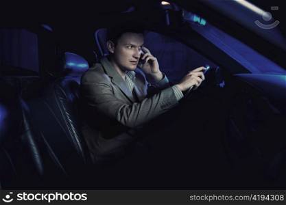 Man driving on mobile phone.
