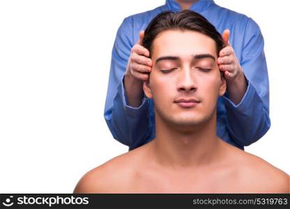 Man during massage session isolated on white
