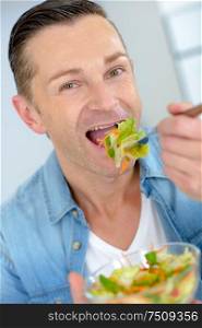 Man eating a healthy salad