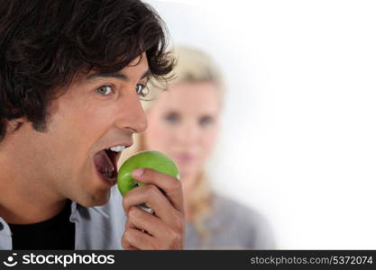 Man eating apple