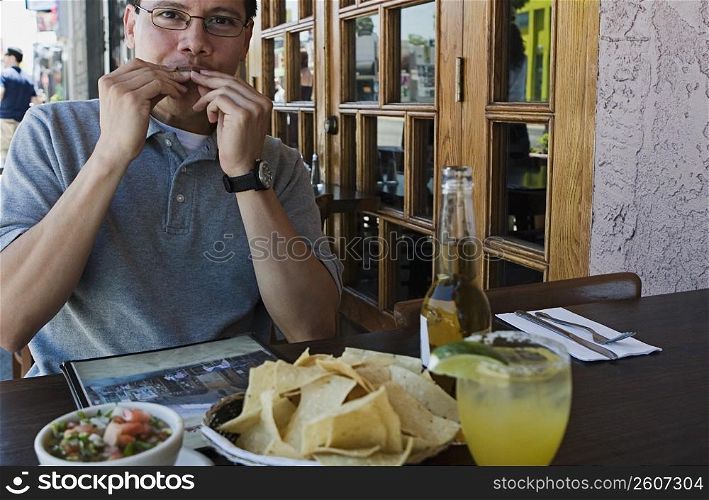 Man eating at outdoor restaurant