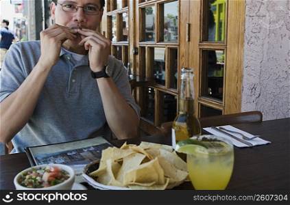 Man eating at outdoor restaurant