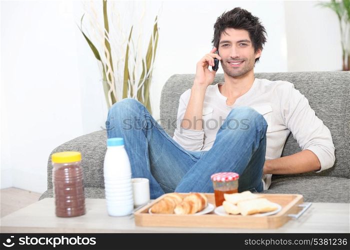 Man eating breakfast at home