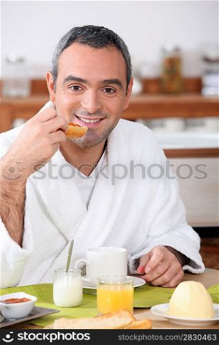 Man eating breakfast in your bathrobe
