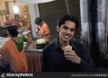 Man eating street food