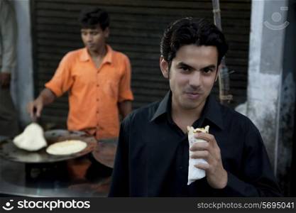 Man eating street food