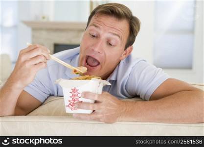 Man Eating Takeaways With Chopsticks