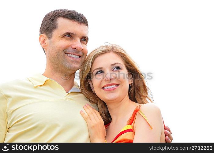 man embraces young woman