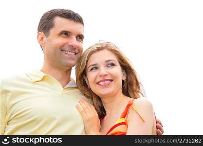 man embraces young woman