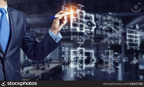 Man engineer at work. Male architect working with virtual construction plan