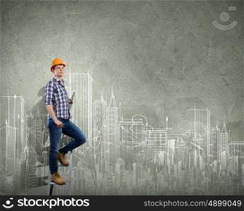Man engineer. Image of man engineer against building project sketch