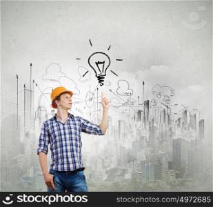 Man engineer. Image of man engineer against building project sketch. Idea concept